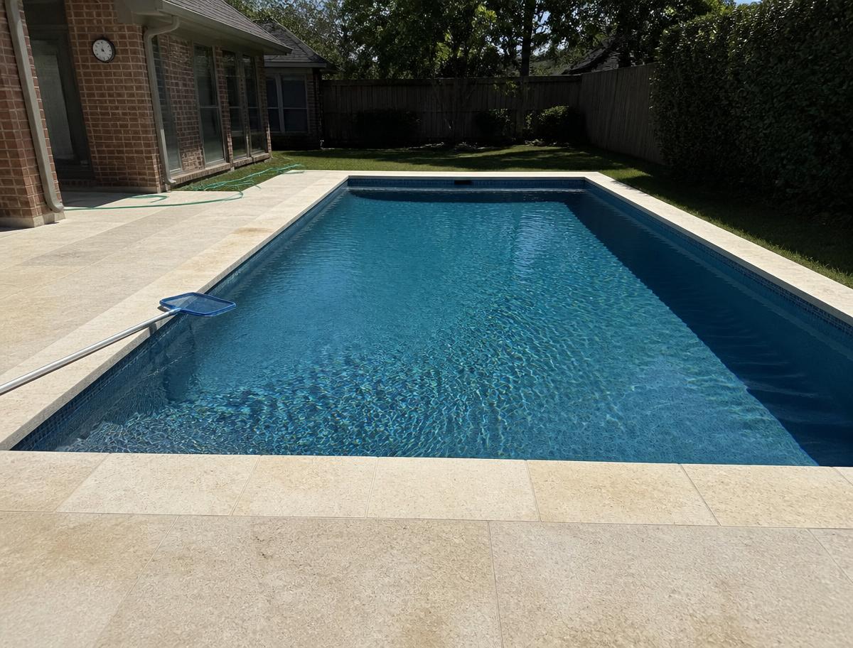 Finished rectangular pool at a Dallas brick home